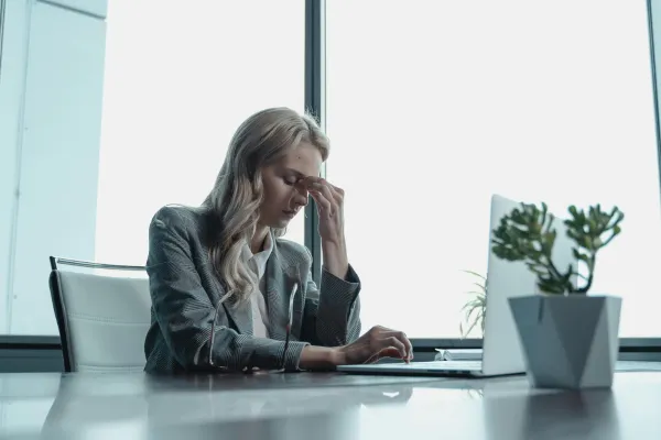 Working woman experiencing stress and discomfort during periods